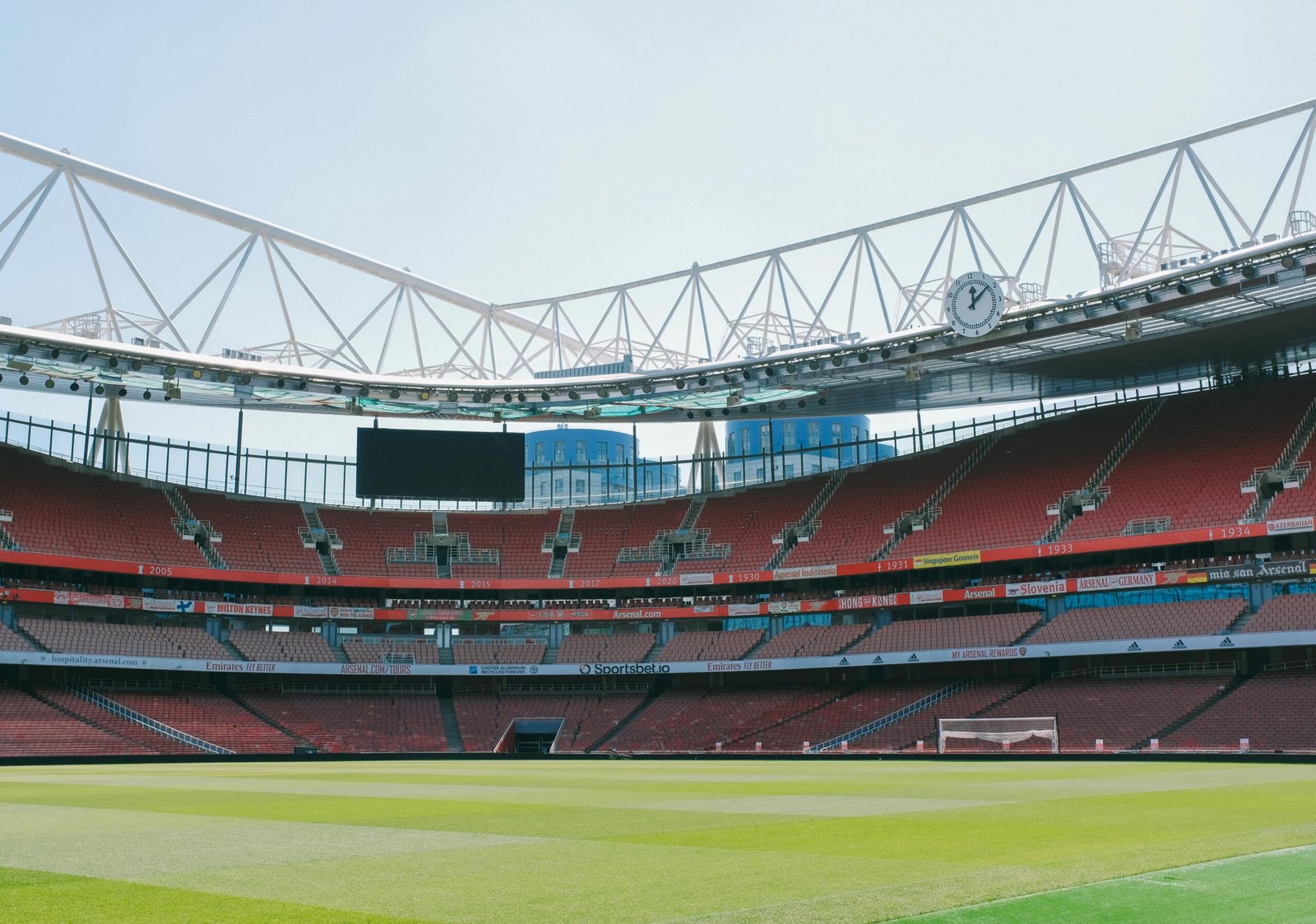 A view of the empty stands and football pitch at Emirates Stadium in London, England.